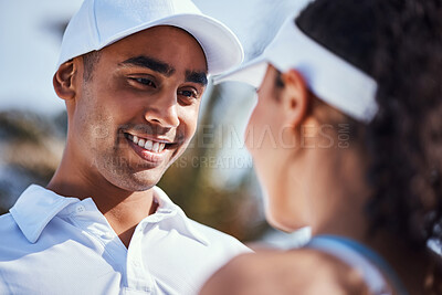 Buy stock photo Shot of a young couple standing together during a game of tennis