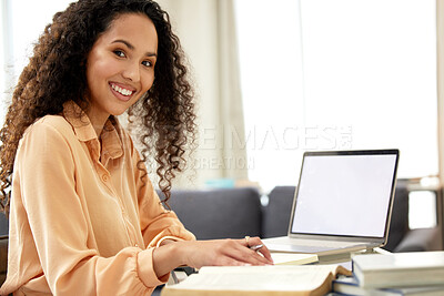 Buy stock photo Shot of a beautiful young woman studying from home