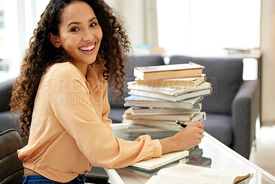 Buy stock photo Shot of a beautiful young woman studying from home