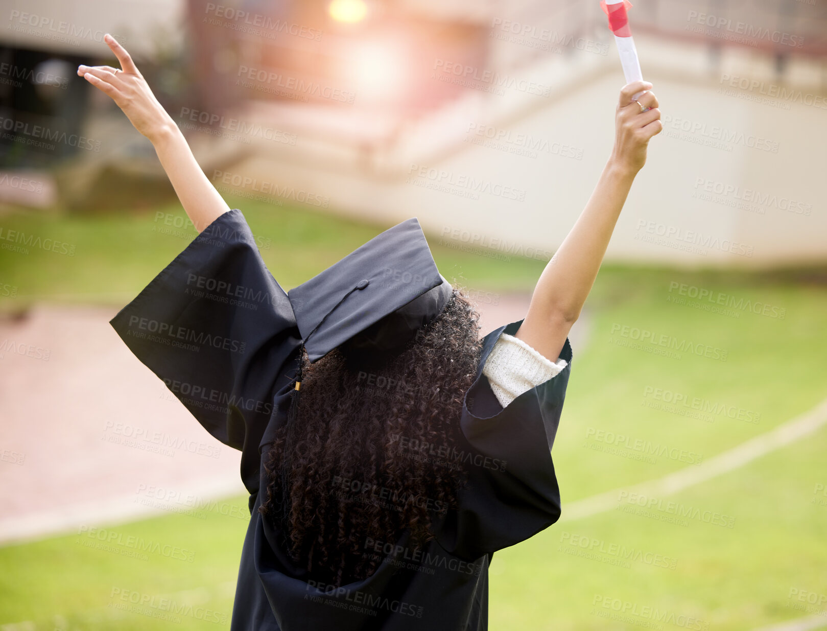 Buy stock photo Graduation, success and student with celebration, yes and study achievement on campus for education. Person back with arms up for scholarship, certificate or diploma in college, university or academy