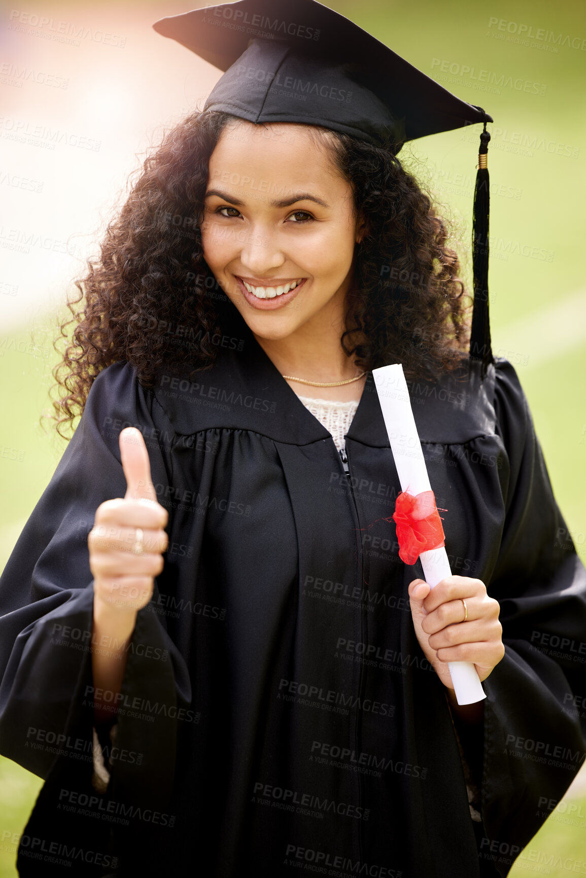 Buy stock photo Woman, graduation and celebrate and portrait, diploma and thumbs up for university student. Prize, scholar and robe with mortar for degree, achievement or female person with certificate for education