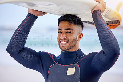 Buy stock photo Man, surfer and board on head at beach, workout and training for water sports competition. Male person, health and travel to ocean or sea for waves, fitness and athlete for exercise in outdoor nature