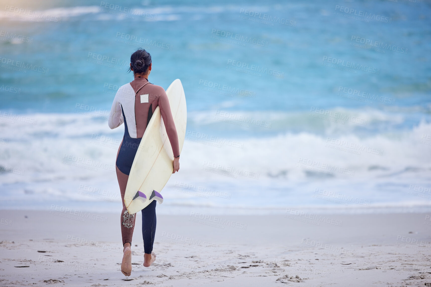 Buy stock photo Girl, walking and board for surfing at beach, workout and training for water sports competition. Female person, back and travel to ocean or sea for waves, fitness and athlete for exercise in nature