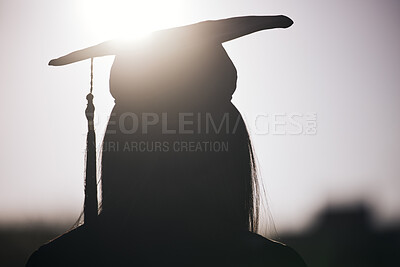 Buy stock photo Graduation, education and silhouette of a student woman outdoor on university campus with lens flare. Future, college and scholarship with a female graduate standing outside at an event from the back