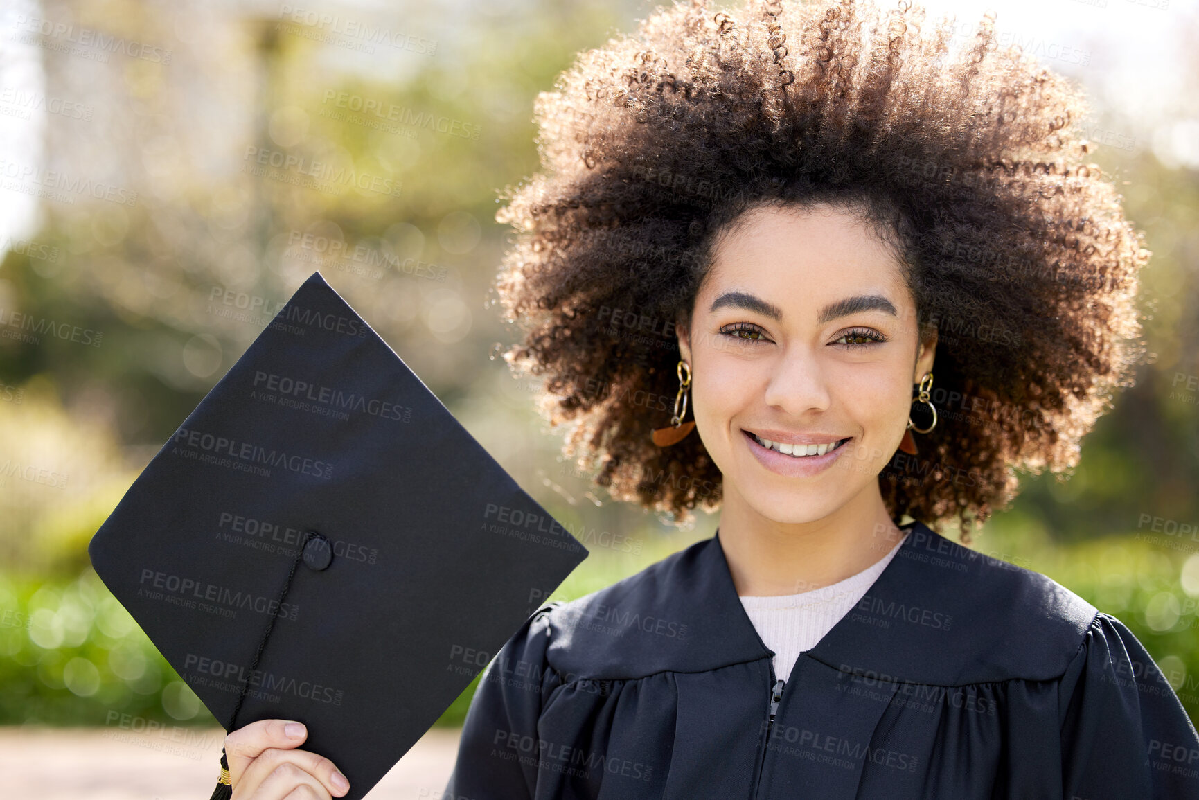 Buy stock photo Graduation, portrait and happy woman outdoor for achievement, success and celebrate at college campus. Face, girl and smile of student graduate with hat at university garden for education in Brazil