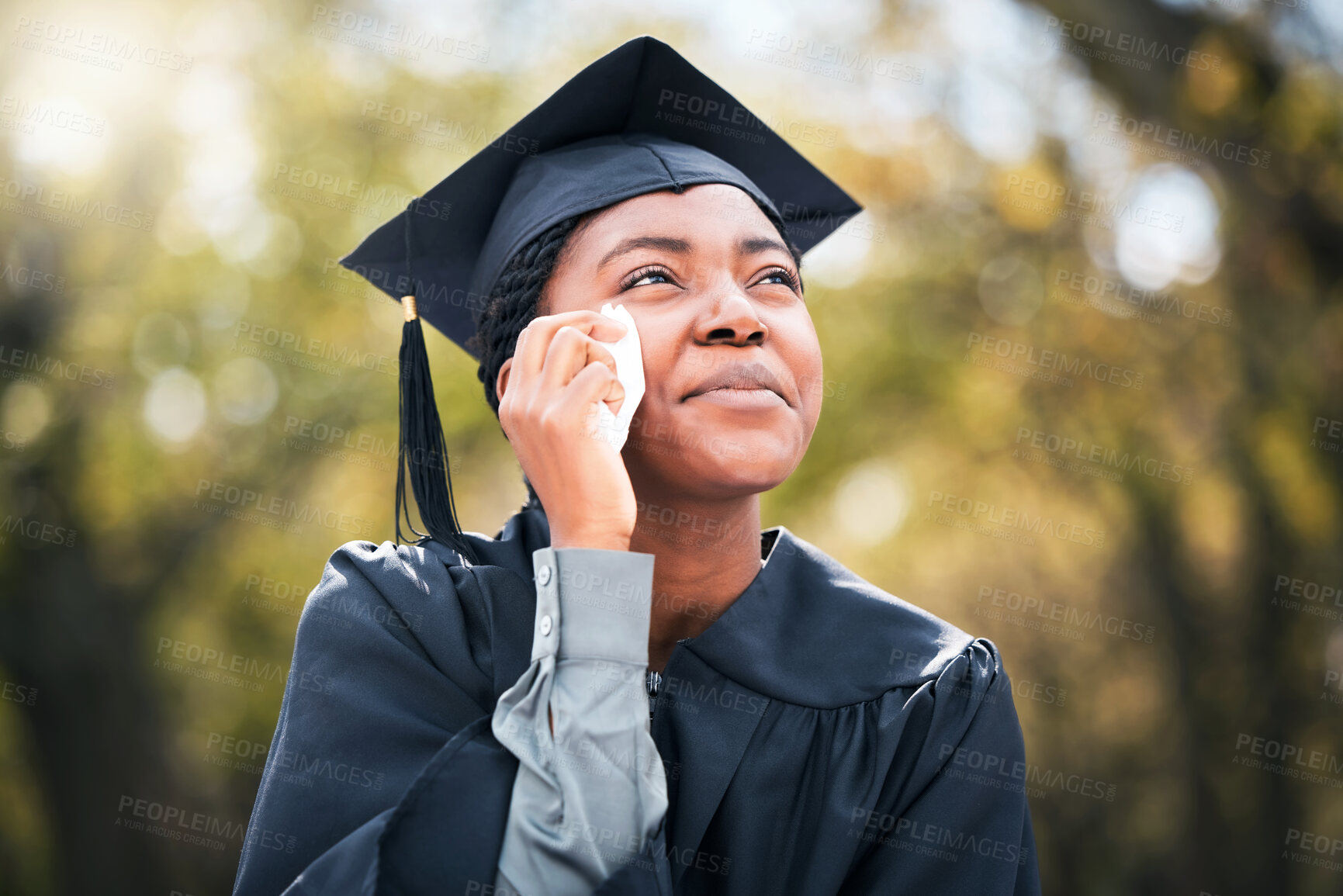 Buy stock photo Outdoor, black woman and crying on graduation day, scholarship and university with achievement. African person, student and girl with robe, emotional or reaction for education goals, tears or success