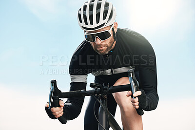 Buy stock photo Cropped shot of a handsome mature man cycling outdoors