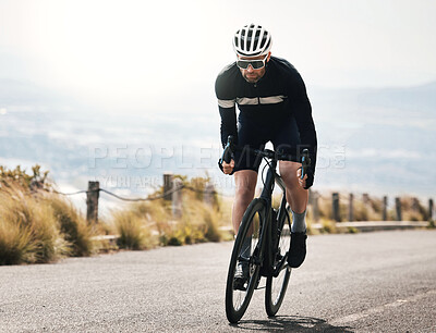 Buy stock photo Full length shot of a handsome mature man cycling outdoors