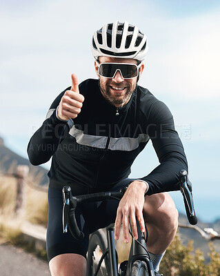 Buy stock photo Cropped shot of a handsome mature man gesturing thumbs up while cycling outdoors