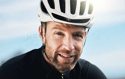 Buy stock photo Cropped portrait of a handsome mature man taking a break while cycling outdoors