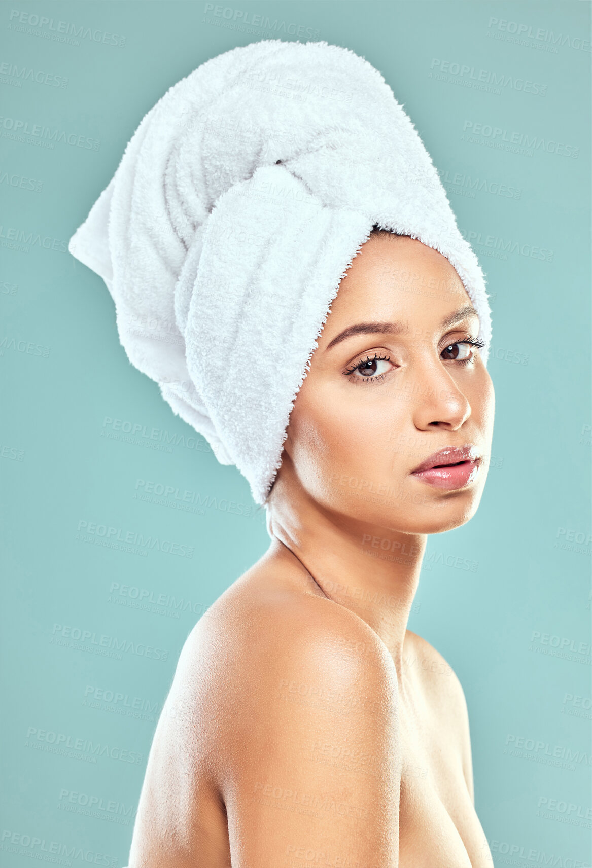 Buy stock photo Portrait, woman and towel for hair in blue background, routine for healthy skincare and beauty. Face, female model and head cloth, natural glow for cosmetics or dermatology by wellness in studio