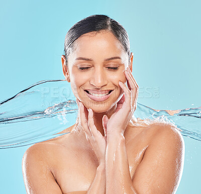 Buy stock photo Shot of a young woman posing against a blue background