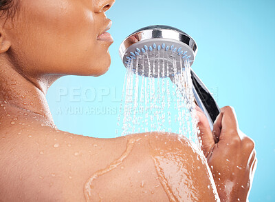 Buy stock photo Shot of an unrecognizable woman showering against a blue background