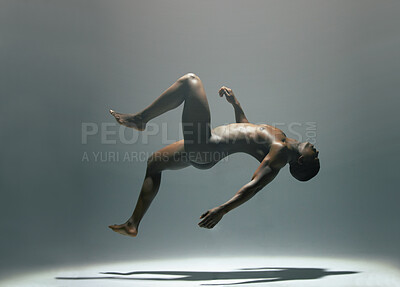 Buy stock photo Nude, body and man in studio for art, levitating and creative, artistic against a grey background. Fine art, model and naked male floating, light and posing bare, falling and erotic art deco isolated