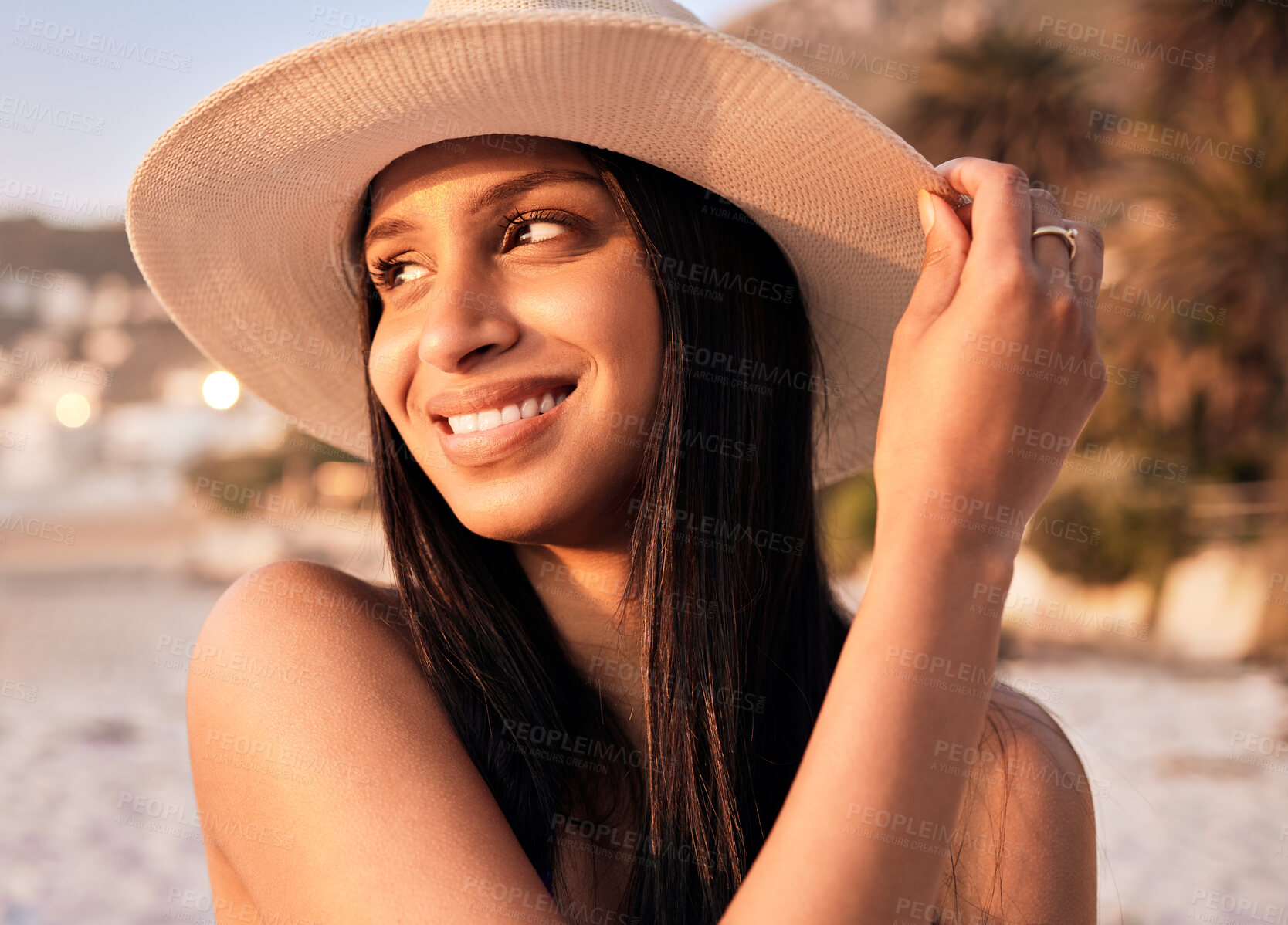 Buy stock photo Woman, hat and beach smile at sunset or holiday vacation, tropical ocean break or happy travel. Indian person, sea tip and destination in evening or summer sunshine in peace relax, quiet time as rest