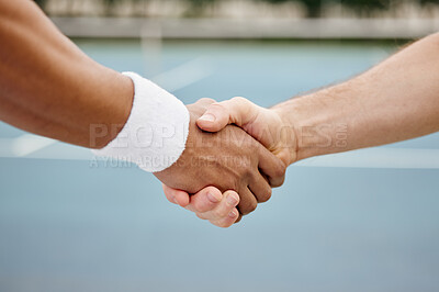 Buy stock photo Cropped shot of two unrecognizable tennis players shaking hands while standing outside on a court