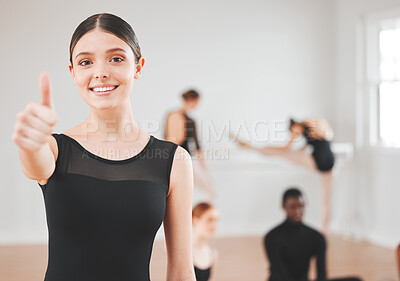 Buy stock photo Shot of a beautiful young ballet dancer showing thumbs up standing in a dance studio