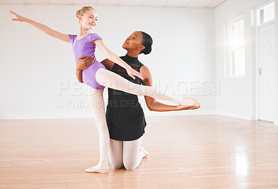 Buy stock photo Shot of a little girl practicing ballet with her teacher in a dance studio