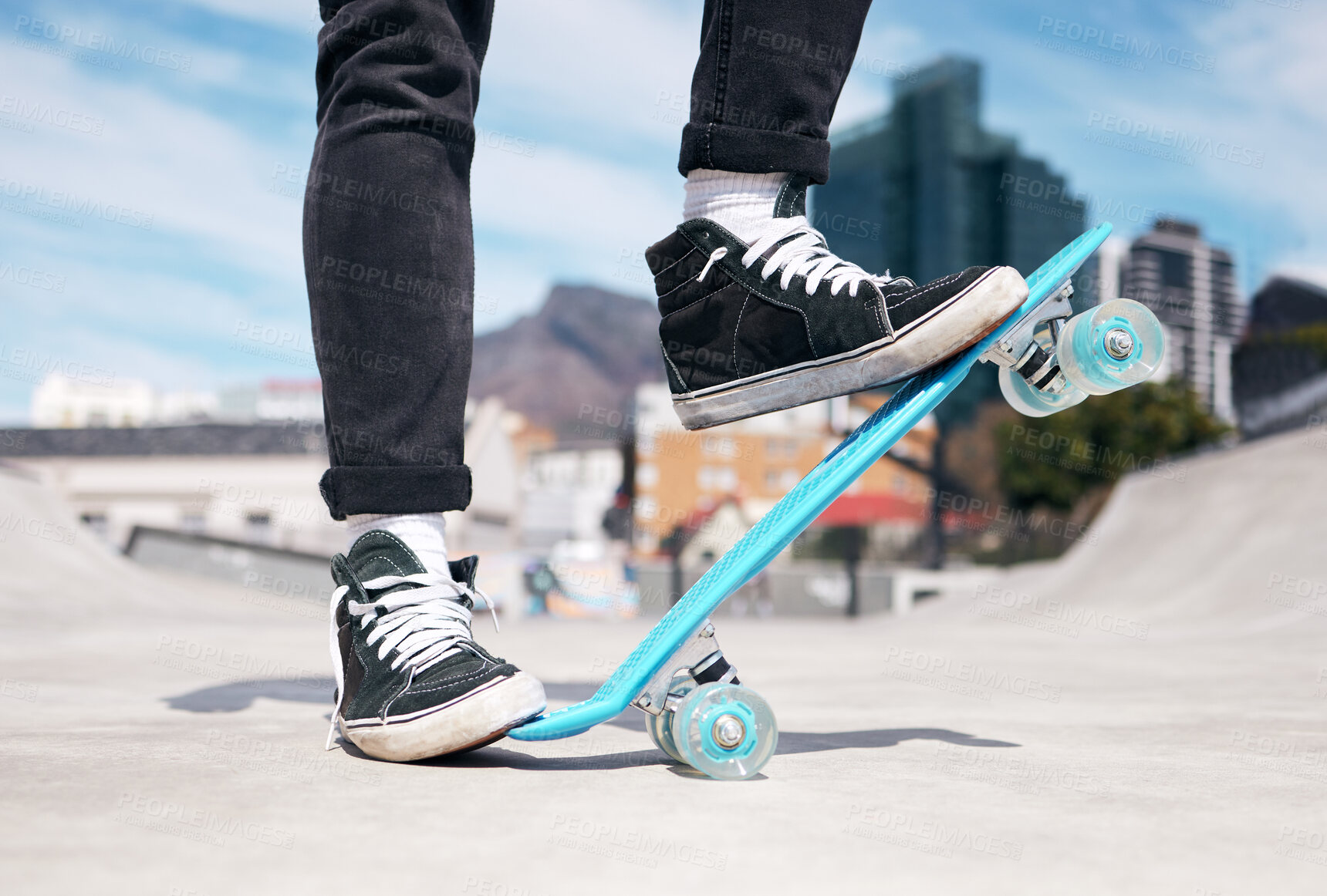 Buy stock photo Cropped shot of an unrecognizable man skateboarding outside