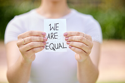 Buy stock photo Woman, hands and card with message in protest, equality or human rights in outdoor nature. Closeup of female person or activist showing note on campaign, community or freedom in democracy or politics