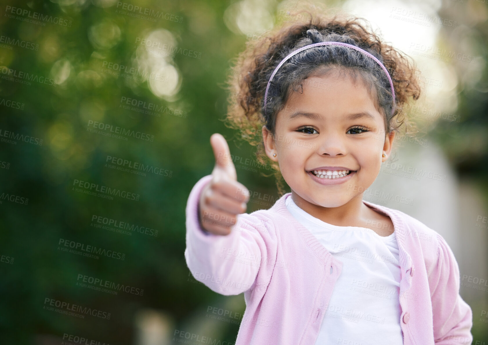 Buy stock photo Happy, thumbs up and portrait of a child in a garden with a smile, emoji and positive emotion. Happiness, excited and cute girl kid standing in outdoor park with approval or satisfaction hand gesture