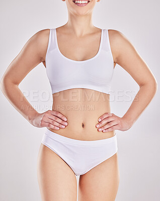 Buy stock photo Cropped shot of a fit young woman posing in her underwear