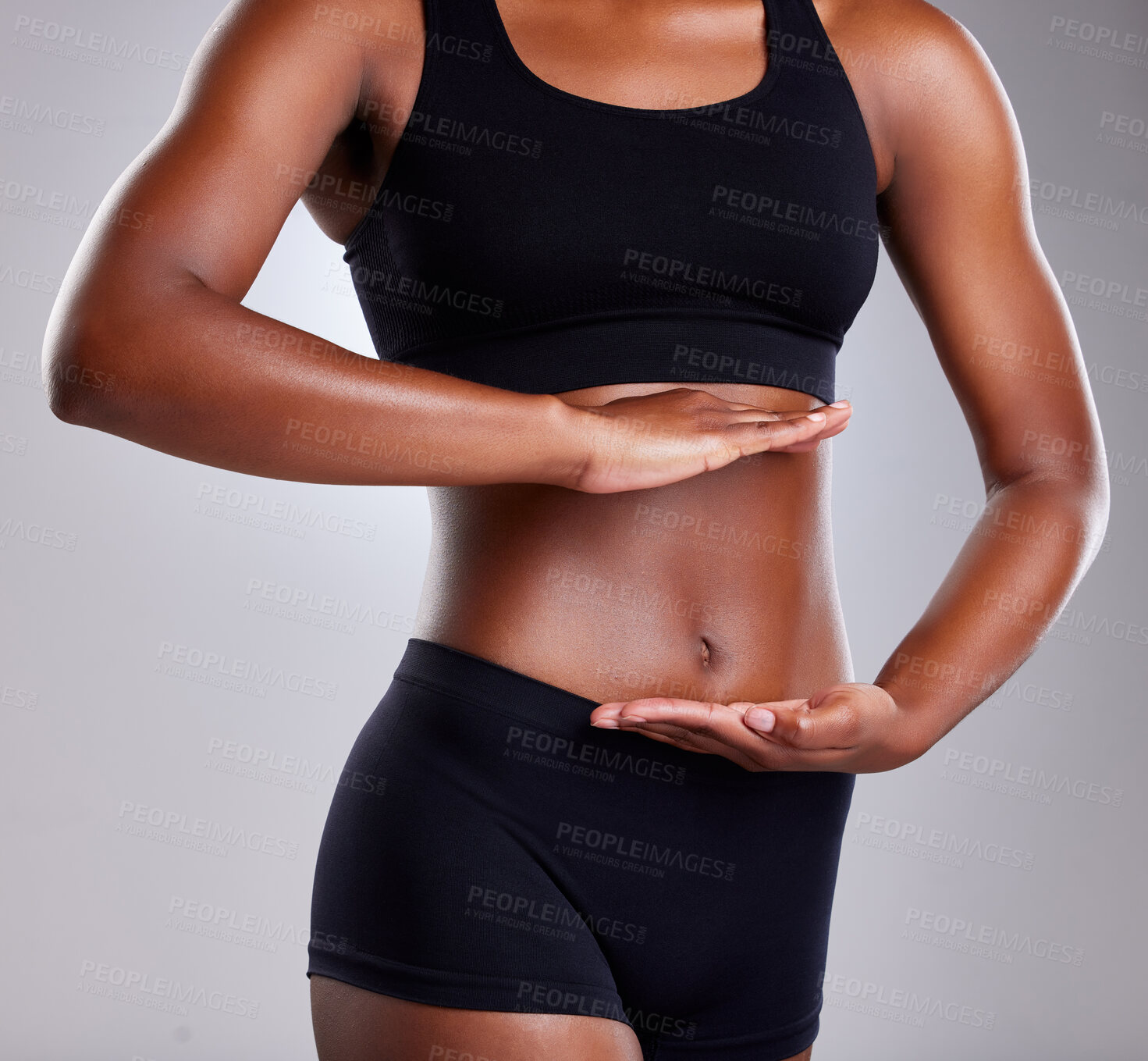 Buy stock photo Wellness, gut health and hands of person, stomach and diet for goal of body, lose weight and fitness. White background, sportswear and abdomen in studio, results and digestion of athlete and exercise