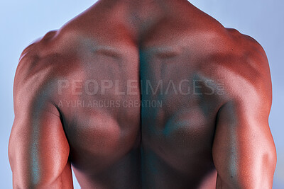 Buy stock photo Shot of a muscular man posing against a studio background