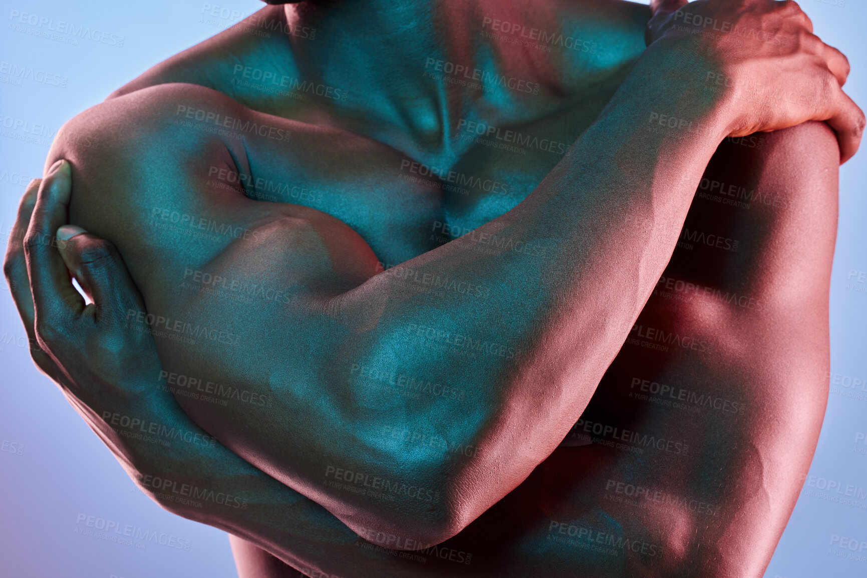 Buy stock photo Shot of a muscular man posing against a studio background