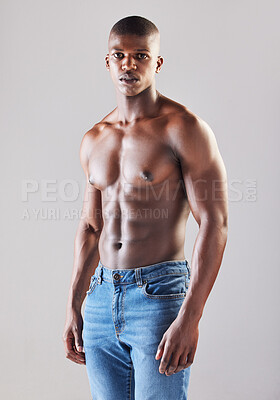 Buy stock photo Black man, healthy and muscle on white background or shirtless with confidence, exercise or strong with stomach. Male person, studio and portrait with jeans for fitness, motivation for workout