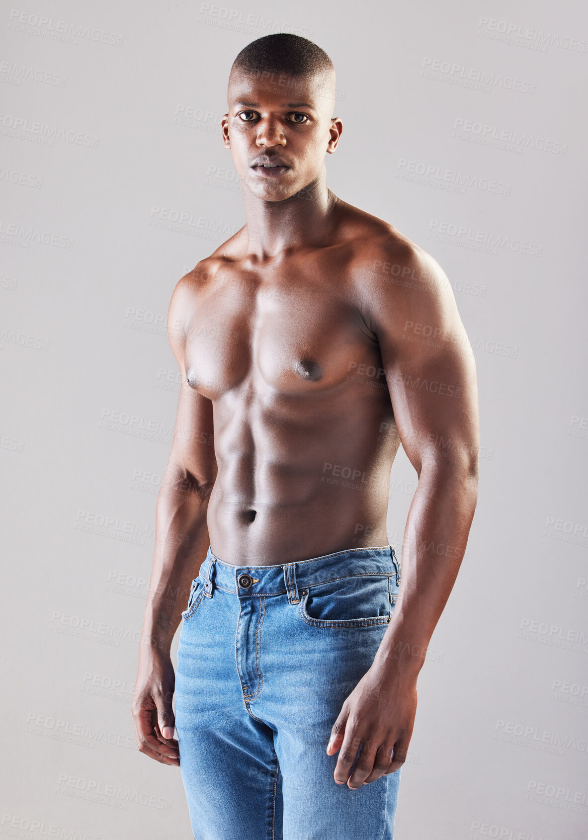 Buy stock photo Black man, healthy and muscle on white background or shirtless with confidence, exercise or strong with stomach. Male person, studio and portrait with jeans for fitness, motivation for workout