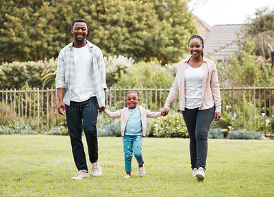 Buy stock photo Black family, walking and outdoor with kid, portrait and Nigeria for love in relationship. People, parents and holding hands with daughter for support, garden and trust mom or dad in backyard of home