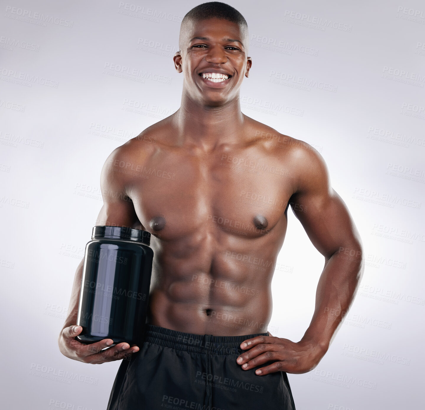 Buy stock photo Black man, bodybuilder and jar in portrait for protein, powder or supplements in studio by white background. Person, container and happy with pharma product for healthy body, nutrition and benefits