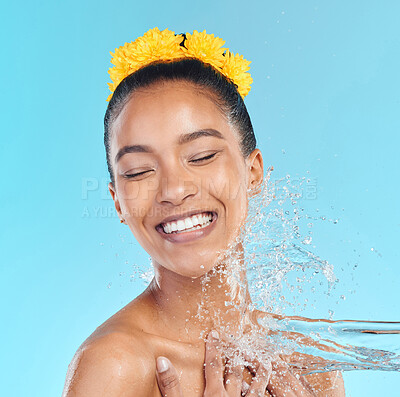 Buy stock photo Shot of an attractive young woman showering against a blue background