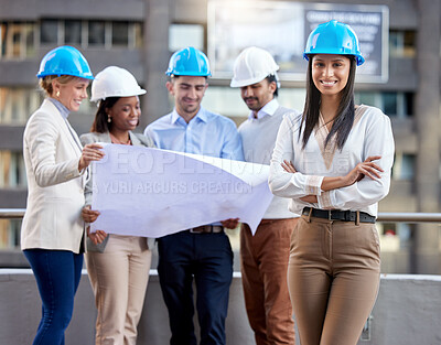 Buy stock photo Shot of a group of architects working against a city a background