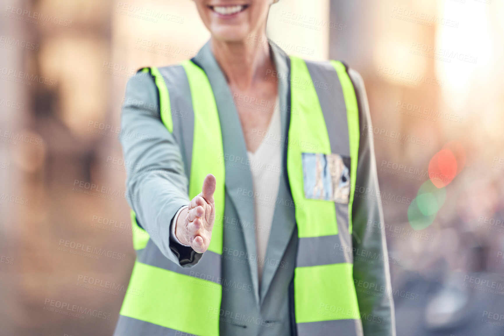 Buy stock photo Construction site, handshake and woman in city by buildings  with welcome, respect or introduction. Person, engineer or architect with open palm for deal, agreement or contract for urban development