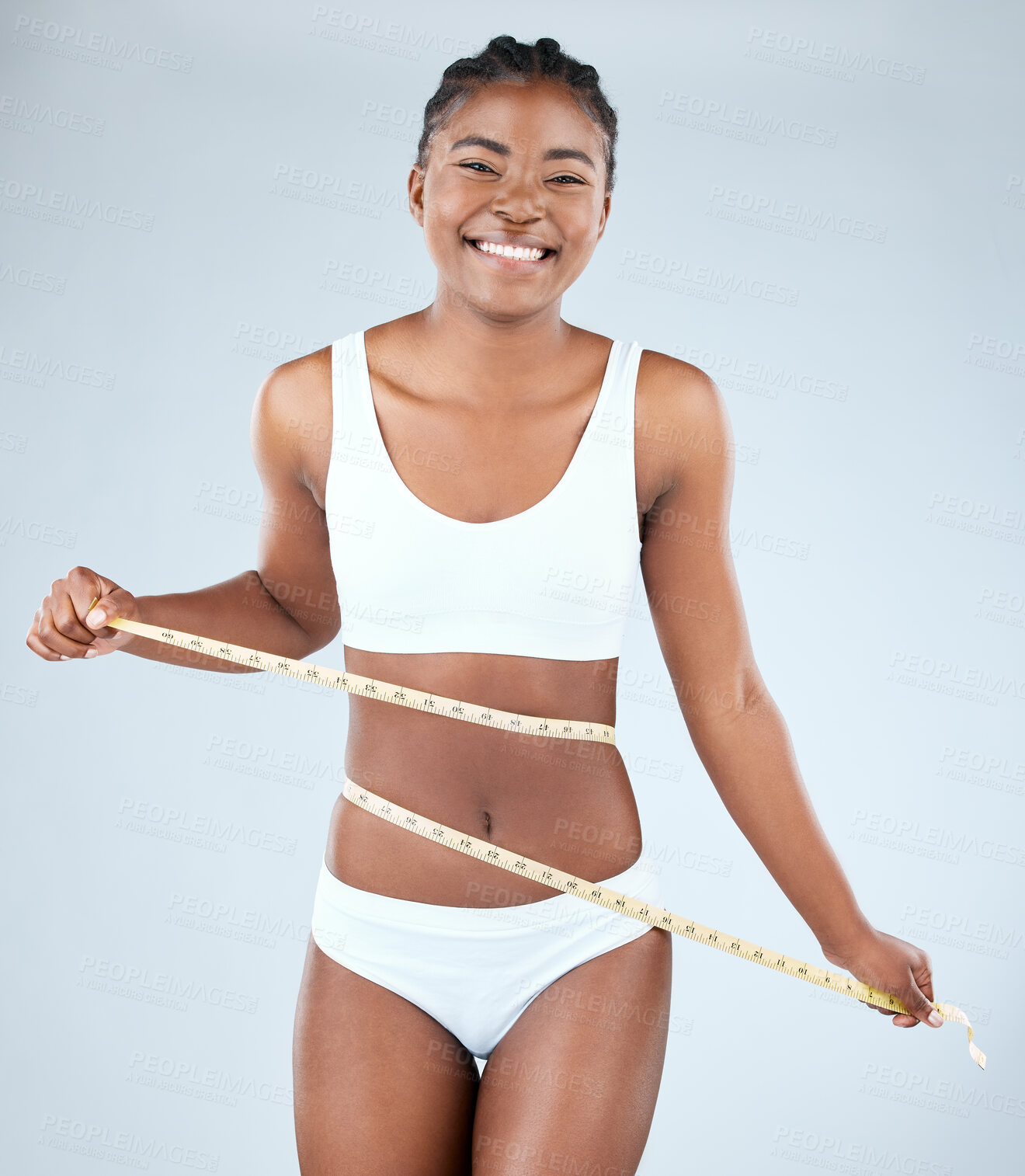 Buy stock photo Black woman, stomach and happy with tape measure in studio on white background on underwear, progress and weight loss. Positivity, body and portrait with results for self care, health and wellness