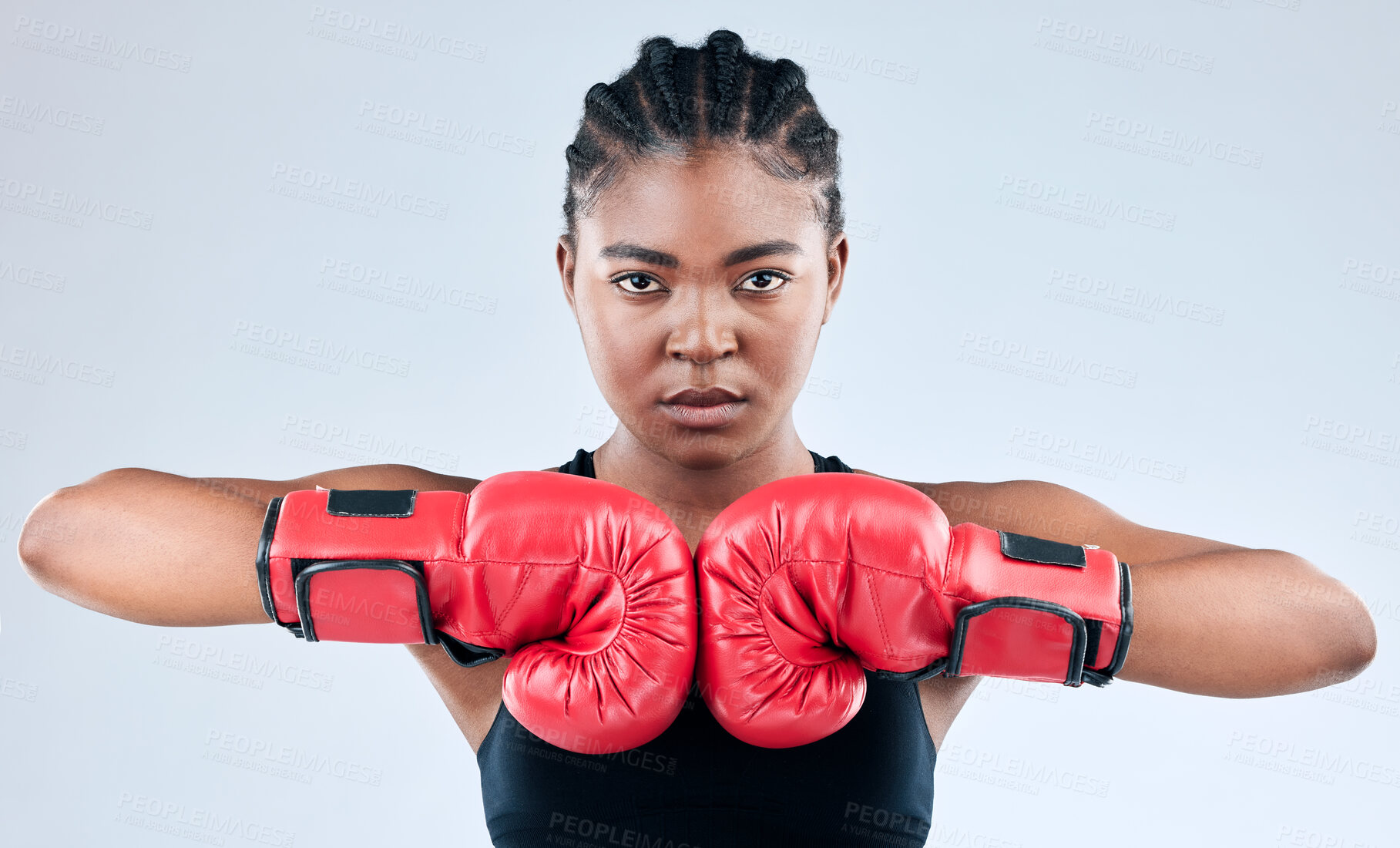 Buy stock photo Black girl, portrait and serious boxer in studio, fist impact and ready for fight on white background. Female person, gloves and martial arts practice or challenge, training and fitness for battle