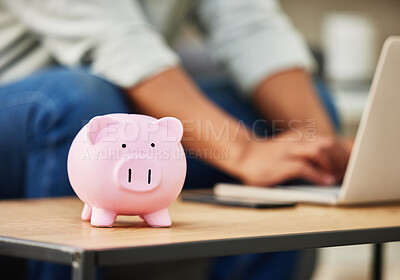 Buy stock photo Shot of a piggy bank on a table  in a house