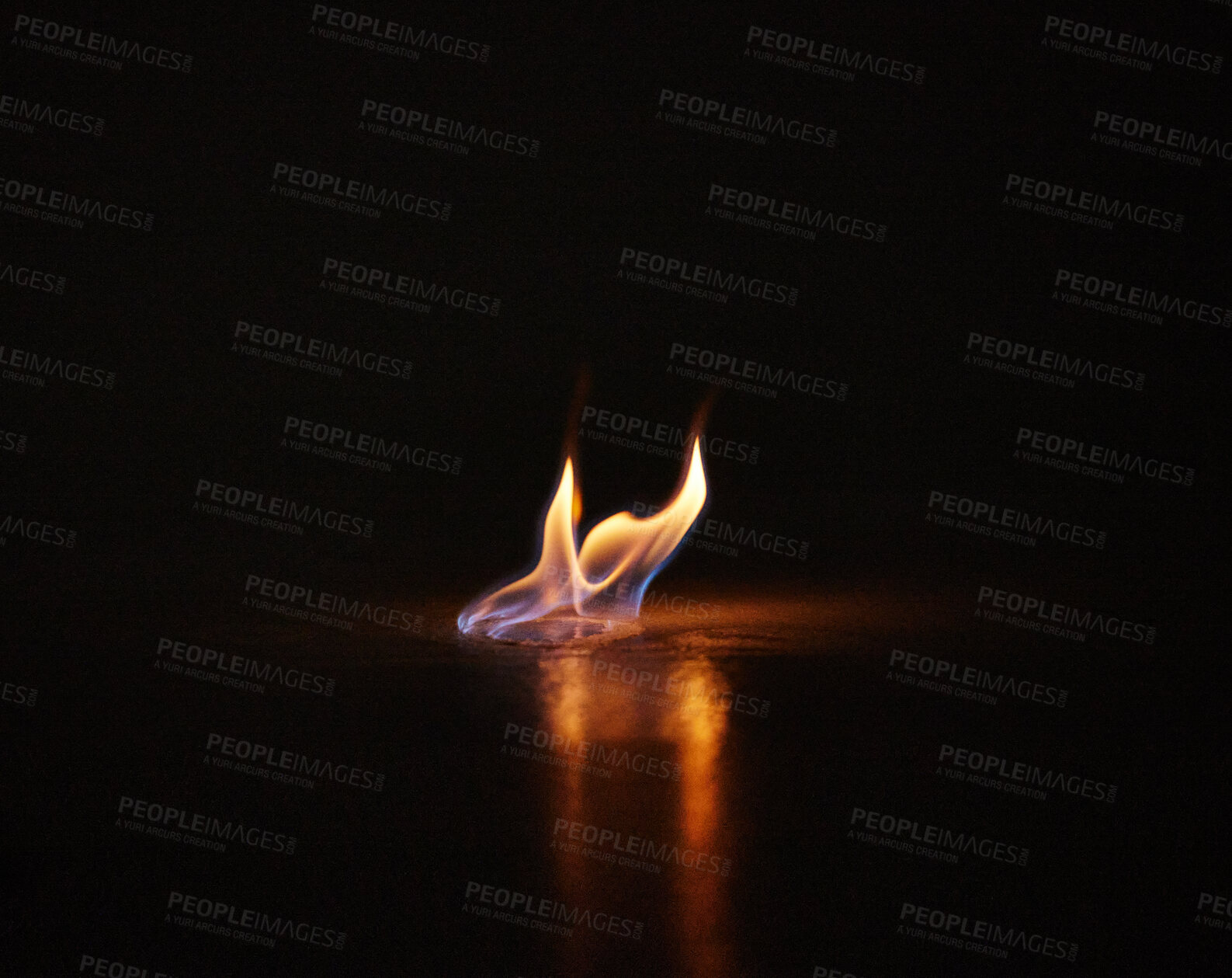 Buy stock photo Studio shot of a small flame burning against a black background