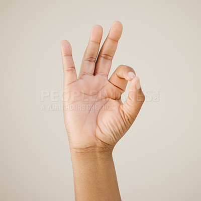 Buy stock photo Ok sign, hand and person with support in studio background for thank you, winner approval or agreement. Deal, great gesture and voting opinion for yes icon, announcement feedback and excellence emoji