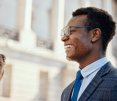 Buy stock photo Shot of a young businessman standing in the city