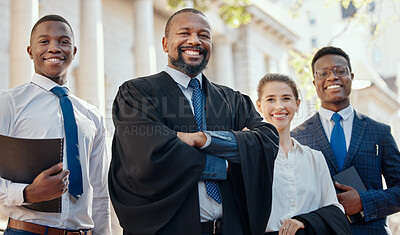 Buy stock photo Shot of a group of lawyers standing in the city