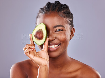 Buy stock photo Avocado, beauty and portrait of natural black woman in studio on gray background for cosmetic wellness. Aesthetic, skincare and superfood with happy model at spa for dermatology or detox nutrition