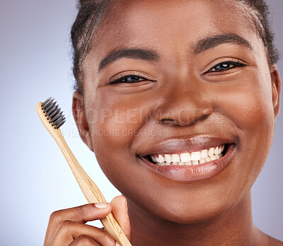 Buy stock photo Bamboo toothbrush, smile and portrait of woman in studio with oral health, morning and hygiene routine. Happy, face and person clean teeth for dental treatment with fresh breath by gray background.