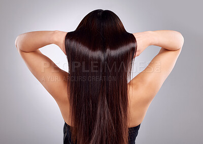 Buy stock photo Hair care, beauty and back of woman in a studio with a keratin, natural and salon treatment. Self care, health and female model with a long, shiny and brunette hairstyle isolated by a gray background