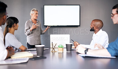 Buy stock photo Senior woman, meeting and coaching on mockup in presentation for team strategy or project management at office. Mature female person, coach or CEO mentor training staff on mock up screen at workplace