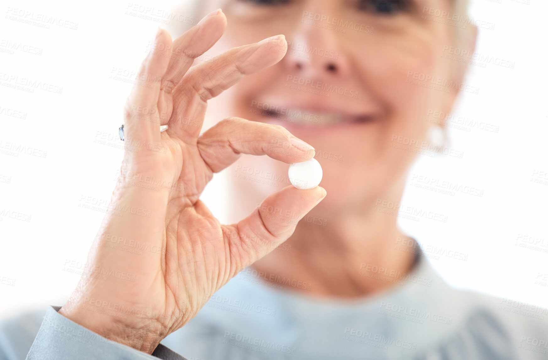 Buy stock photo Hand, pill and medicine of senior, person and woman with smile for healthcare, capsule and supplement. Vitamins, prescription and treatment with science from pharmacy, healthy and antibiotics