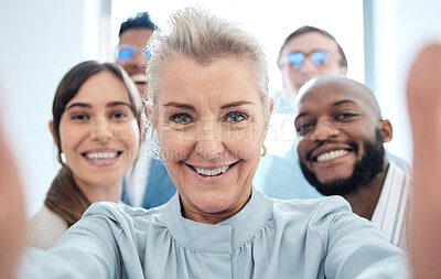 Buy stock photo Portrait of a group of confident businesspeople taking selfies together in an office