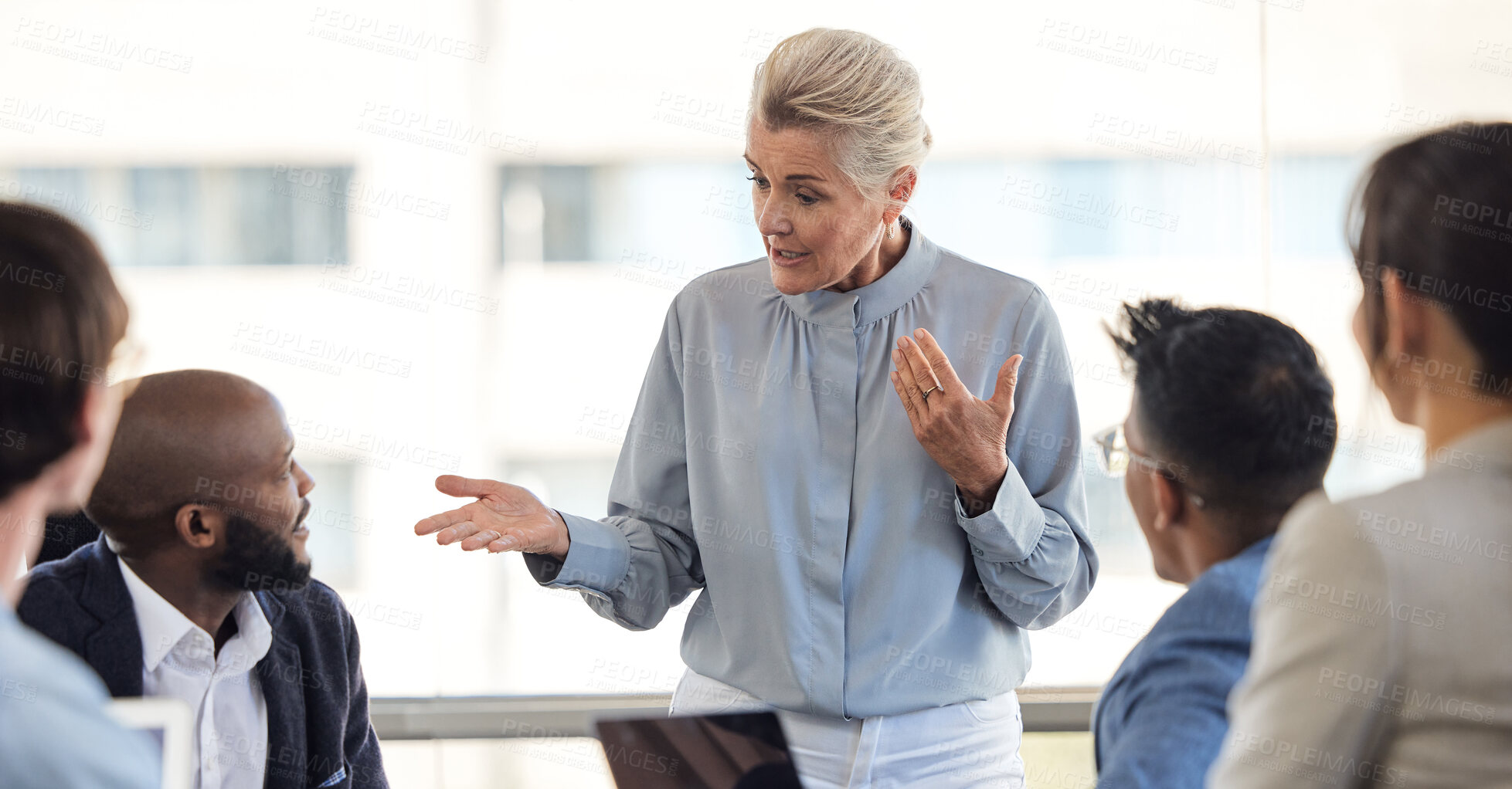 Buy stock photo Meeting, planning a management business woman talking to her team of staff in the boardroom for company vision. Coaching, leadership and mentor with a female CEO in discussion with her employee group